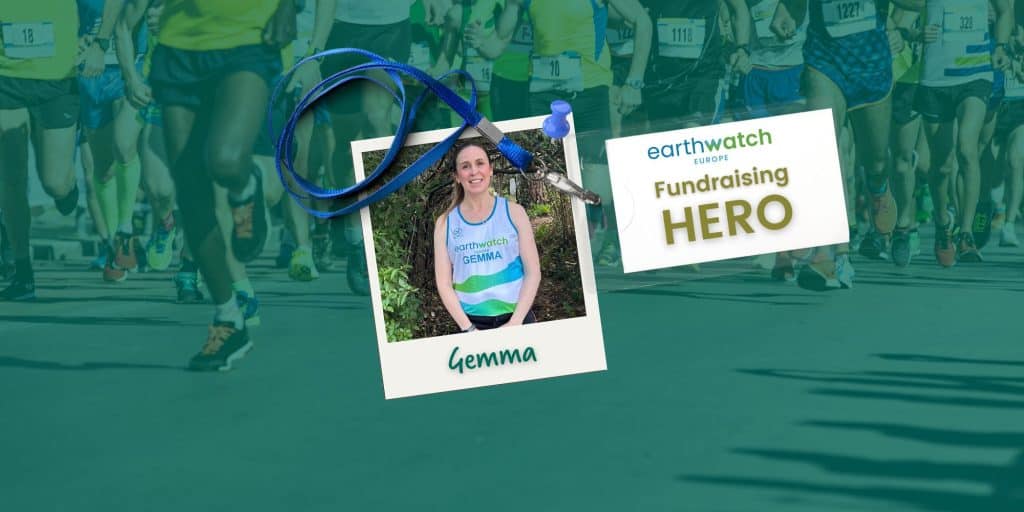 A polaroid photo showing Gemma in her branded Earthwatch running vest and a lanyard with a sign saying "Fundraising Hero"
