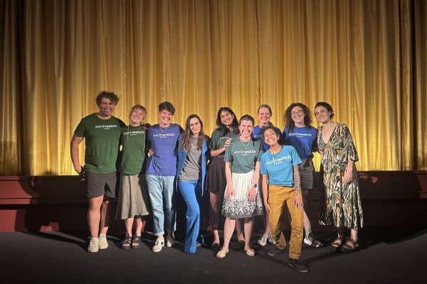 Members of the Earthwatch Team post for a photo following the film screening