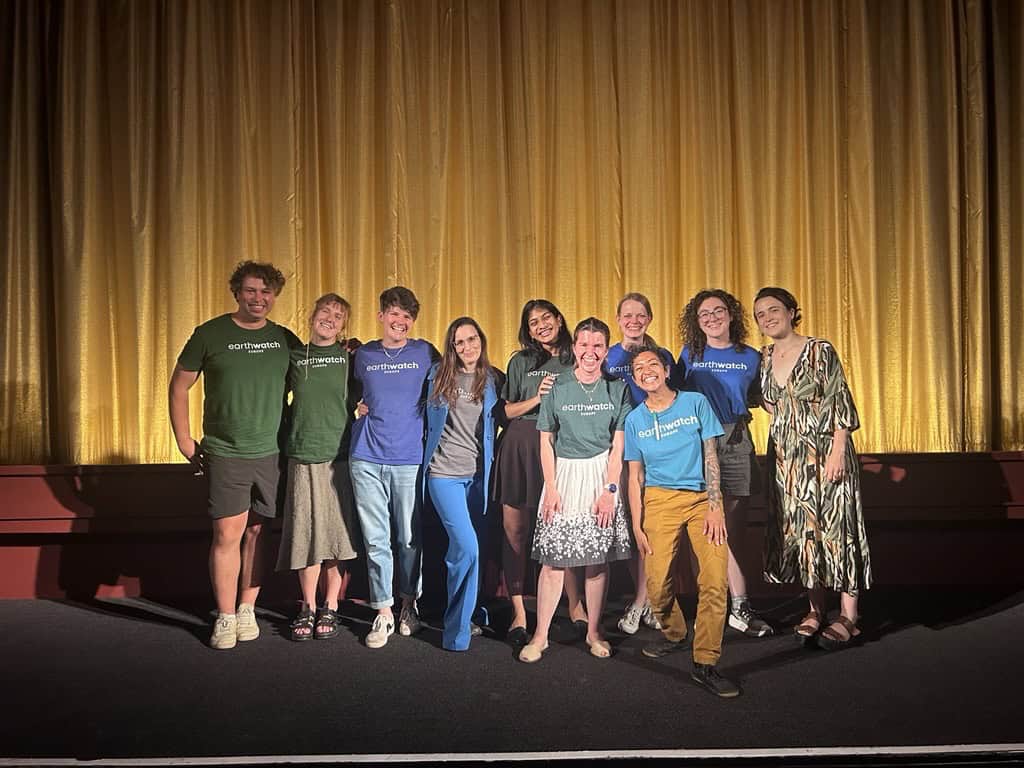 Members of the Earthwatch Team post for a photo following the film screening